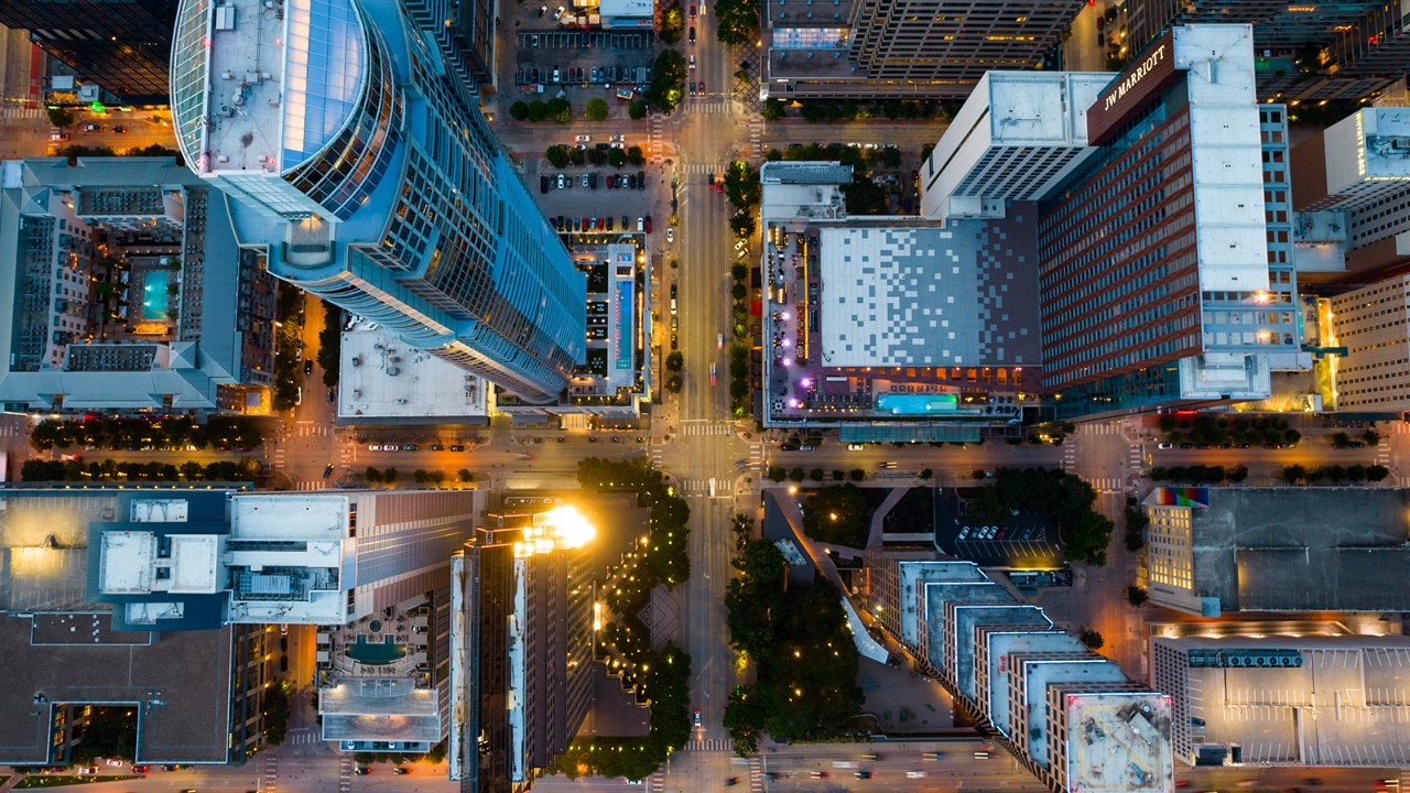 An aerial shot of an urban setting with lots of tall downtown buildings.