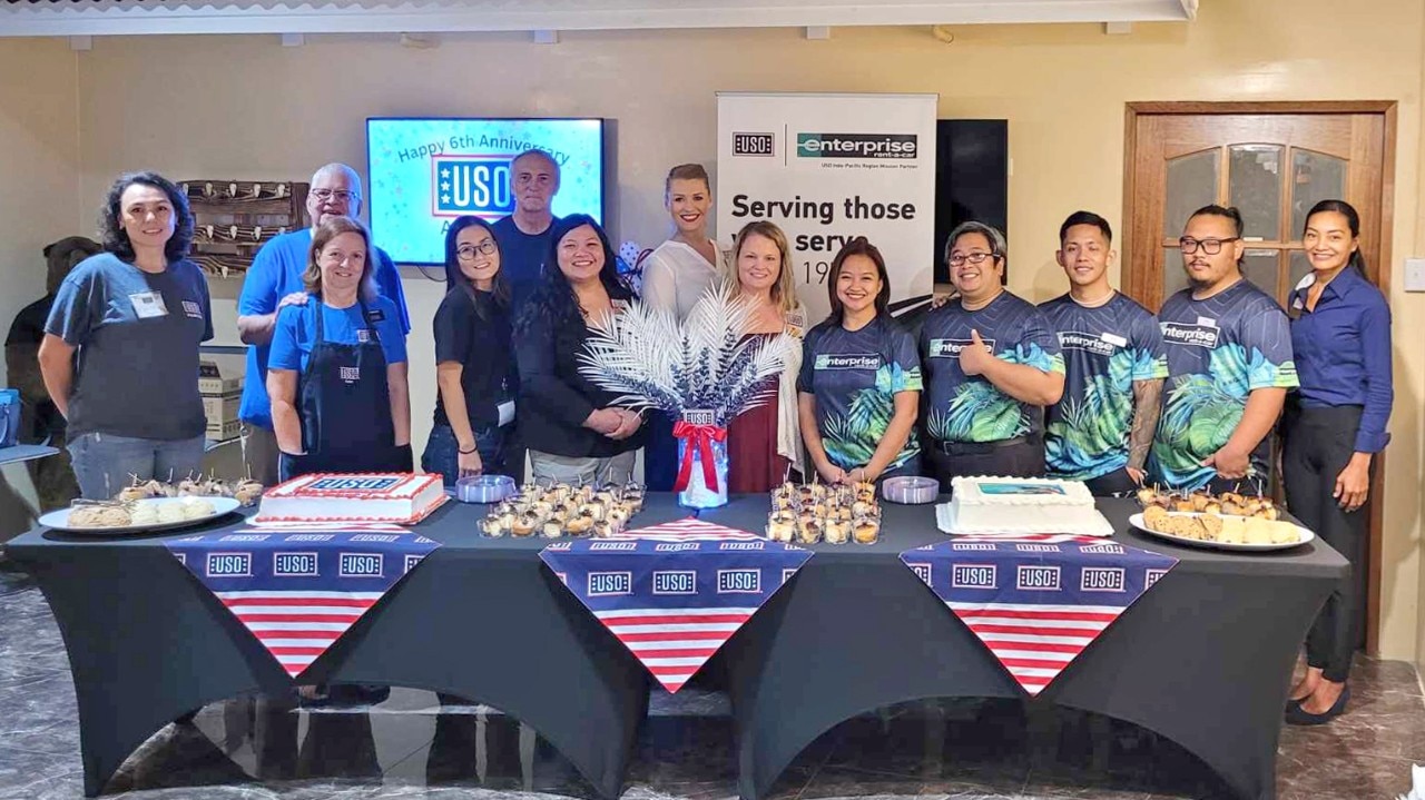 A group shot of individuals involved with the USO partnership.